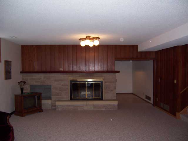 Basement Family Room with wood burning fireplace