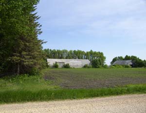 Left side tree line and Quonset Building