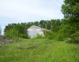 Quonset with concrete floor from center of property