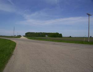 Street Scene looking West across Nicollet County 20 (363 Avenue)